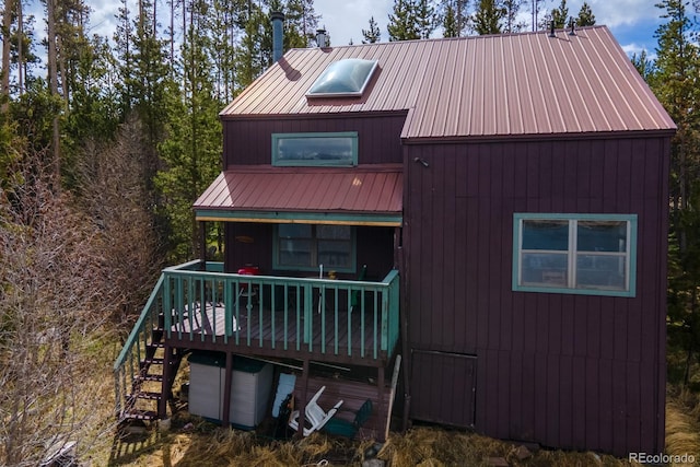 527 Gcr 494, Grand Lake, CO 80447 - rear view of property with stairs, metal roof, and a deck