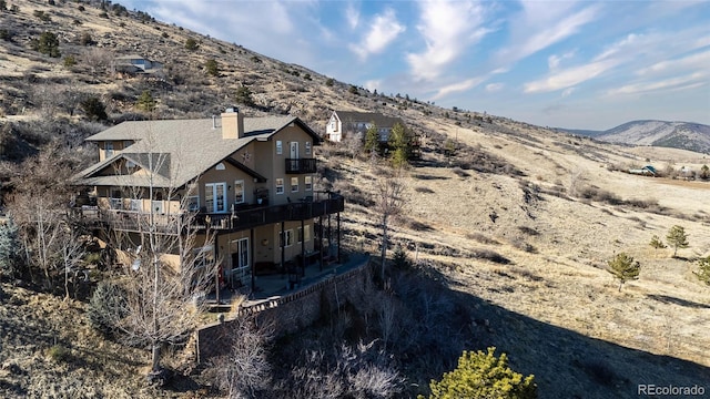 drone / aerial view featuring a mountain view