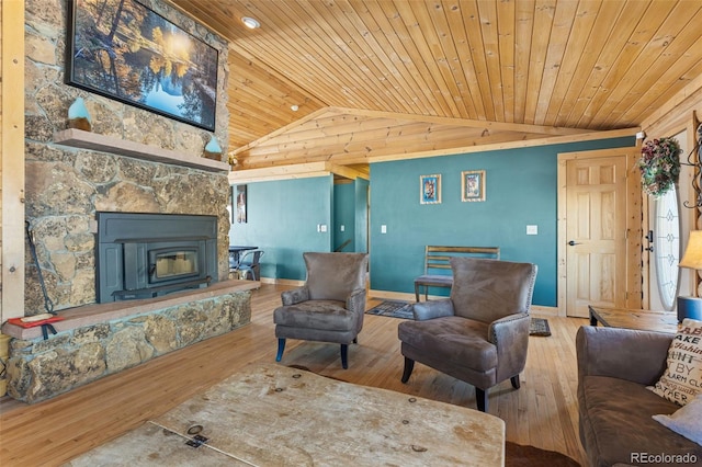 living room with hardwood / wood-style flooring, a fireplace, wooden ceiling, and lofted ceiling