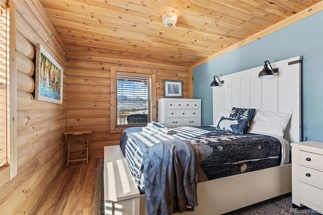 bedroom featuring wood-type flooring, log walls, and wood ceiling