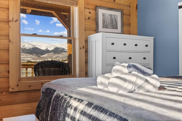 bedroom with a mountain view and rustic walls