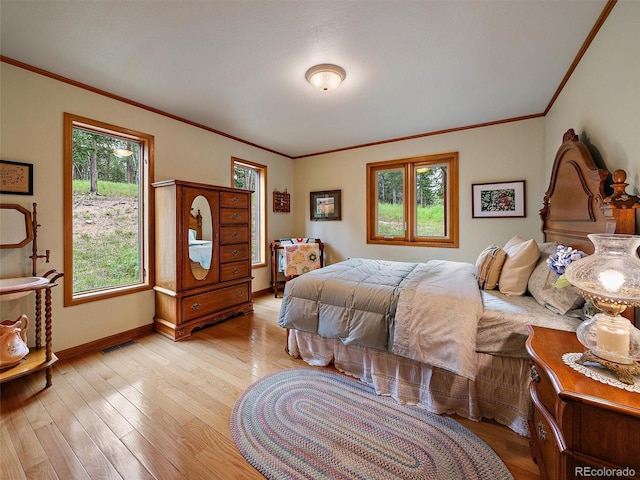13094 Molly Dr, Conifer, CO 80433 - bedroom with light wood-type flooring and ornamental molding