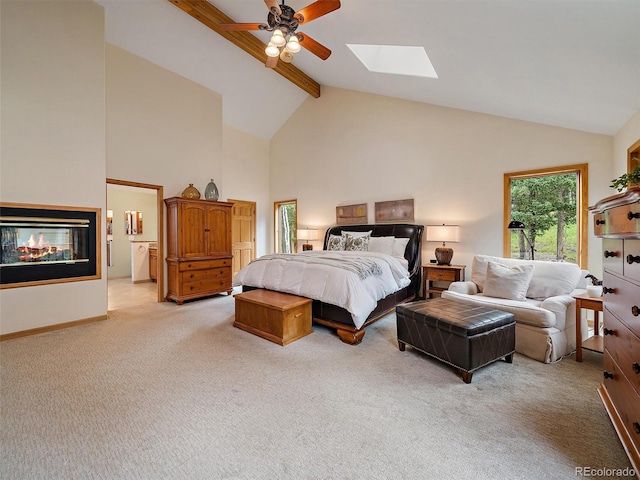 13094 Molly Dr, Conifer, CO 80433 - bedroom featuring beam ceiling, light carpet, a skylight, high vaulted ceiling, and ceiling fan