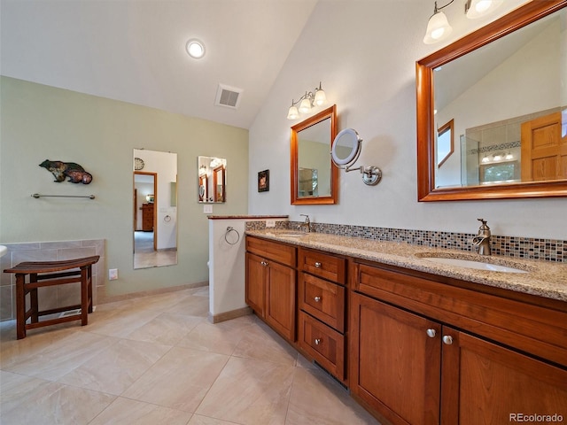 13094 Molly Dr, Conifer, CO 80433 - full bathroom featuring vaulted ceiling, double vanity, and tile patterned flooring