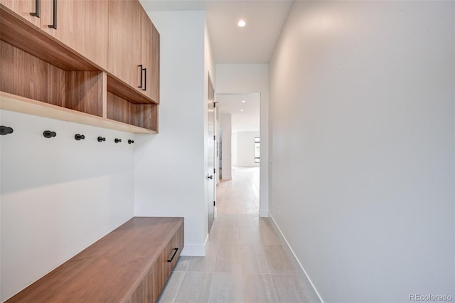 mudroom featuring light tile patterned floors