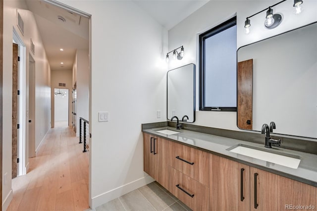 bathroom with vanity and hardwood / wood-style flooring