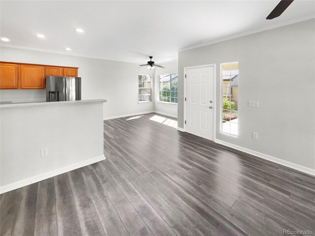 kitchen with stainless steel refrigerator with ice dispenser, wood-type flooring, and ceiling fan