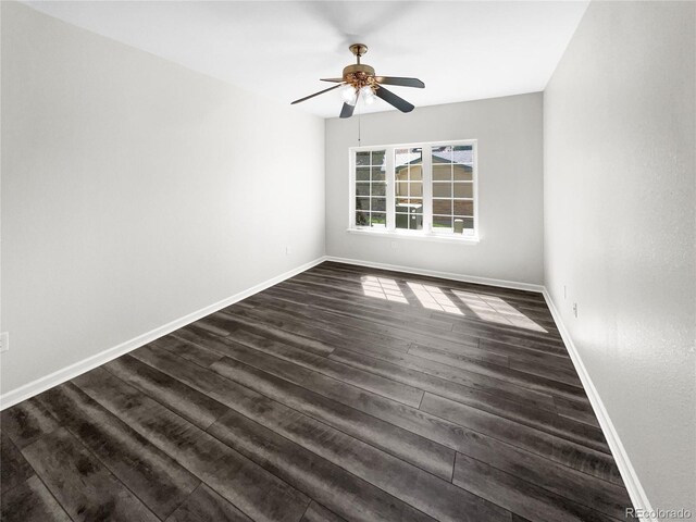 unfurnished room featuring dark hardwood / wood-style floors and ceiling fan