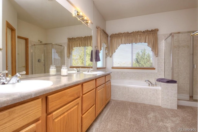 698 Larimer Creek Dr, Monument, CO 80132 - bathroom featuring a shower stall, a bath, and double vanity