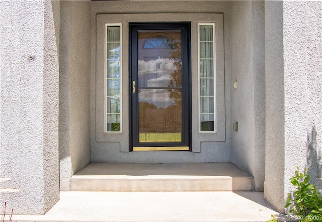 698 Larimer Creek Dr, Monument, CO 80132 - doorway to property featuring stucco siding