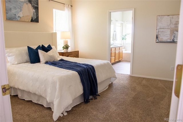 698 Larimer Creek Dr, Monument, CO 80132 - bedroom with carpet flooring, multiple windows, and ensuite bath