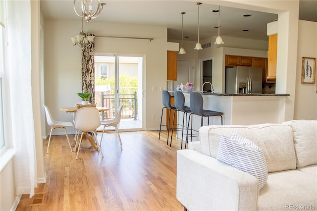 698 Larimer Creek Dr, Monument, CO 80132 - living area featuring light wood finished floors and baseboards