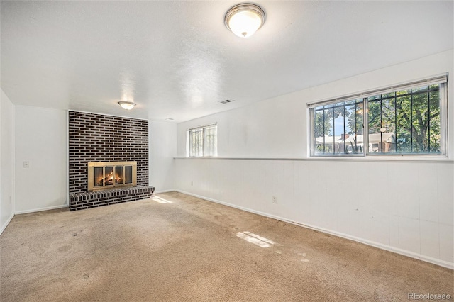 1533 S Jamaica St, Aurora, CO 80012 - unfurnished living room with carpet floors and a fireplace