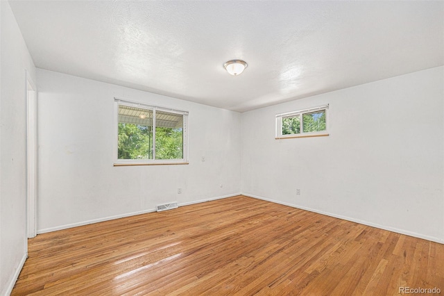 1533 S Jamaica St, Aurora, CO 80012 - unfurnished room featuring light wood-style floors
