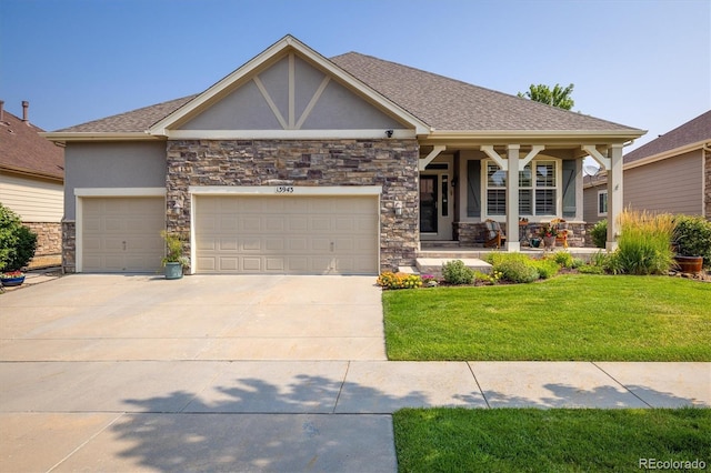 craftsman-style home with stucco siding, a front lawn, a porch, concrete driveway, and a garage