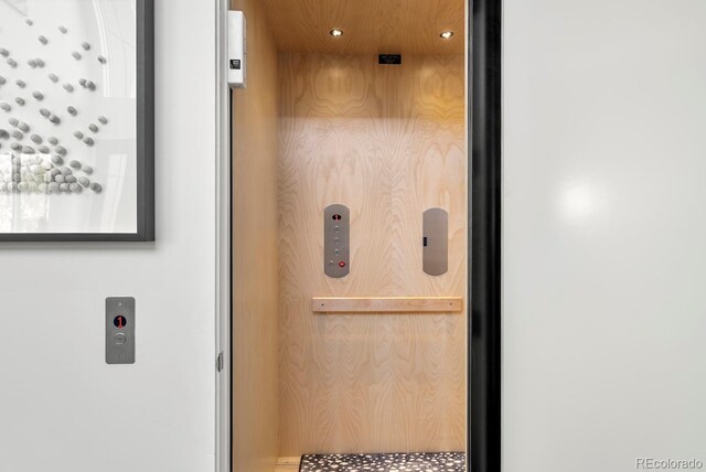 room details with elevator and recessed lighting