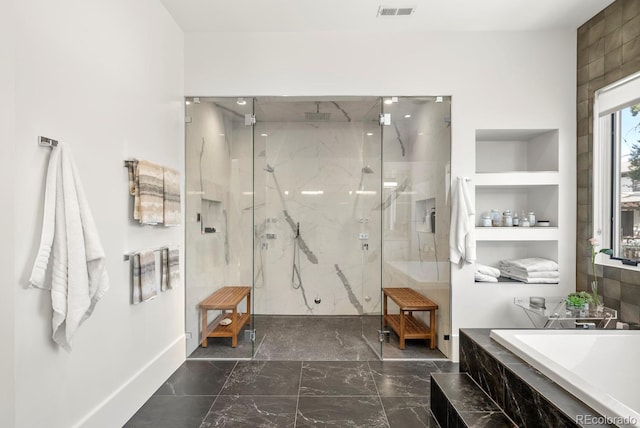 full bathroom with a garden tub, visible vents, marble finish floor, a marble finish shower, and built in shelves