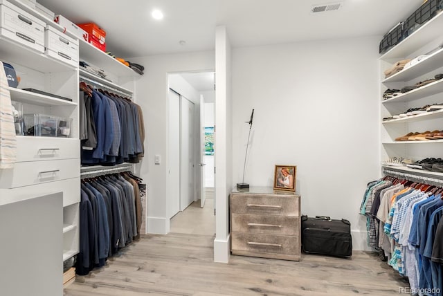 walk in closet featuring visible vents and light wood-type flooring