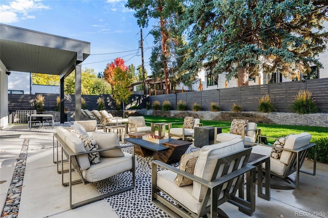 view of patio / terrace featuring outdoor lounge area and a fenced backyard