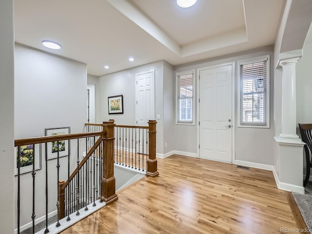 14310 Kalamath St, Westminster, CO 80023 - entrance foyer with decorative columns, light wood-style flooring, plenty of natural light, and recessed lighting