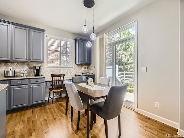 14310 Kalamath St, Westminster, CO 80023 - dining area featuring light wood-type flooring and plenty of natural light