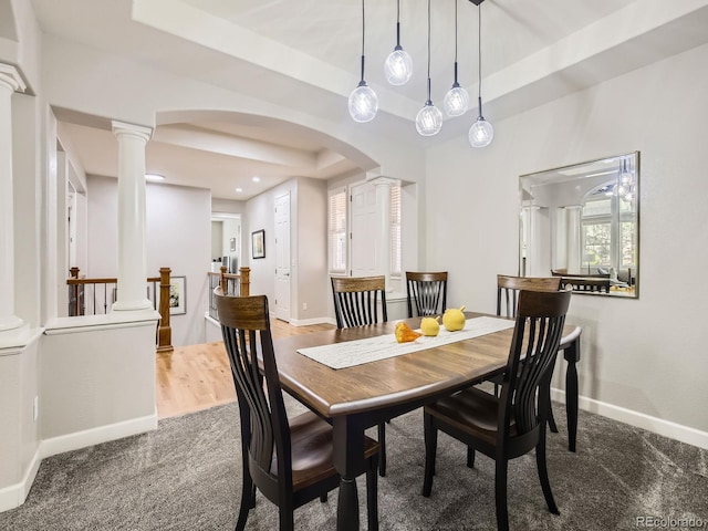 14310 Kalamath St, Westminster, CO 80023 - dining room featuring ornate columns, carpet, arched walkways, and a tray ceiling