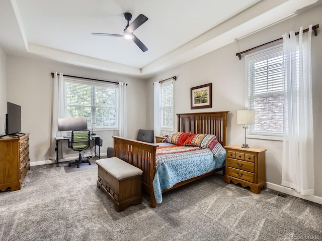 14310 Kalamath St, Westminster, CO 80023 - carpeted bedroom featuring a raised ceiling, a desk, and ceiling fan