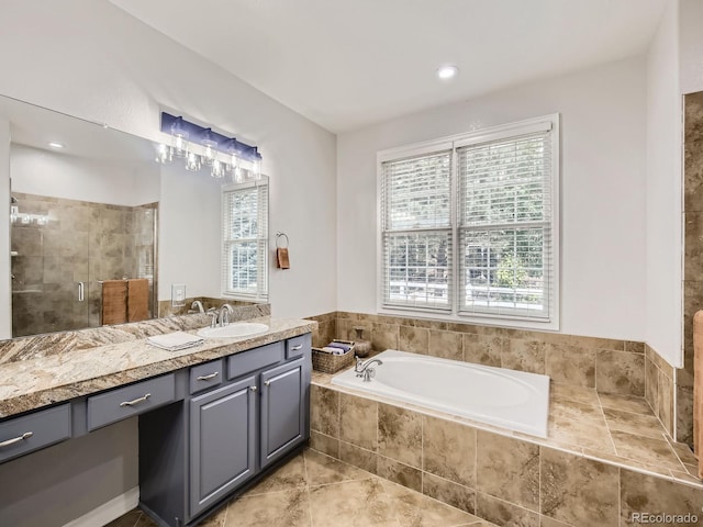 14310 Kalamath St, Westminster, CO 80023 - bathroom with vanity, a garden tub, and a stall shower