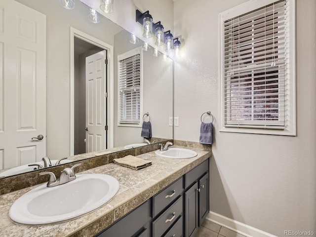 14310 Kalamath St, Westminster, CO 80023 - bathroom with double vanity and tile patterned flooring