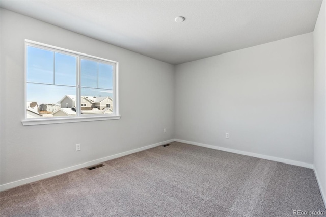 empty room with carpet flooring