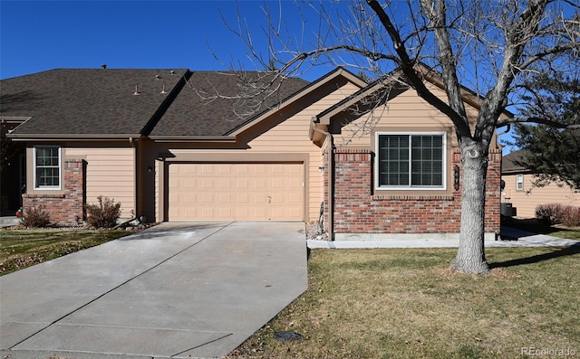 single story home featuring a front yard and a garage