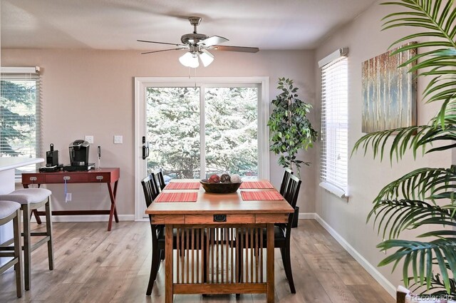 6475 Orion Way, Arvada, CO 80007 - dining area featuring light wood-style flooring, a ceiling fan, and an office area