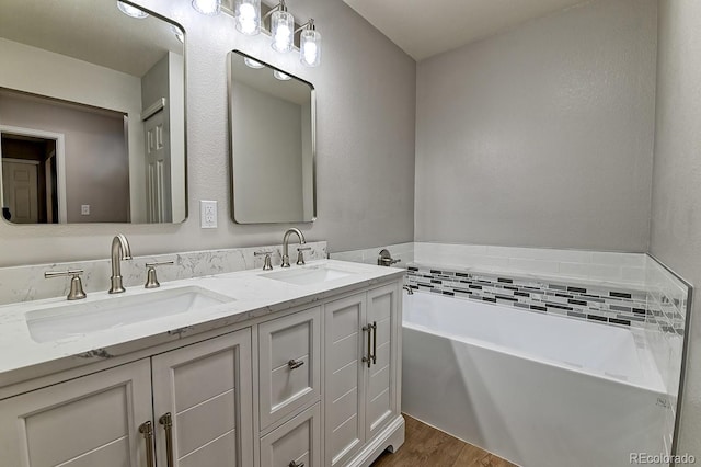 6475 Orion Way, Arvada, CO 80007 - full bath with double vanity, wood finished floors, and a bath