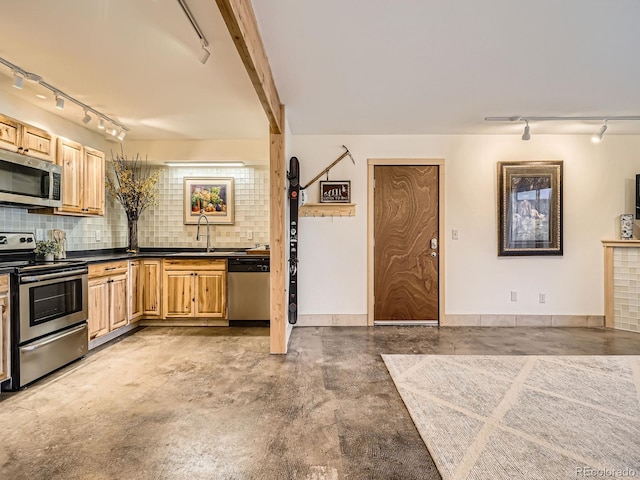 kitchen with sink, concrete floors, light brown cabinets, appliances with stainless steel finishes, and decorative backsplash