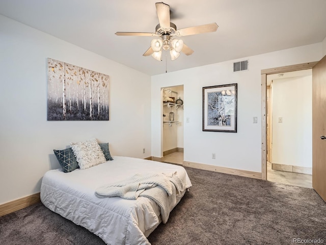 carpeted bedroom featuring ceiling fan and a closet