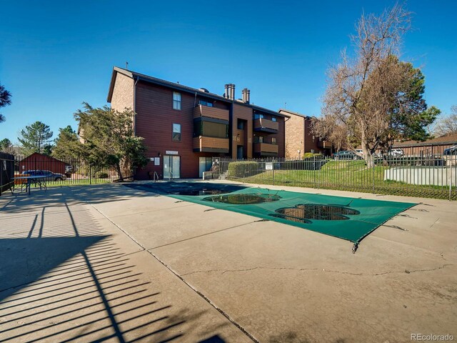 400 Zang St Unit 1-105, Lakewood, CO 80228 - community pool featuring a patio area