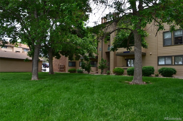 400 Zang St Unit 1-105, Lakewood, CO 80228 - view of property's community with a lawn
