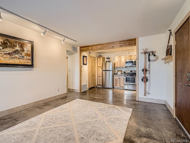 400 Zang St Unit 1-105, Lakewood, CO 80228 - kitchen with stainless steel appliances, finished concrete floors, baseboards, rail lighting, and backsplash