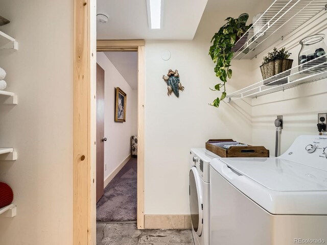 400 Zang St Unit 1-105, Lakewood, CO 80228 - laundry room with washing machine and clothes dryer and baseboards