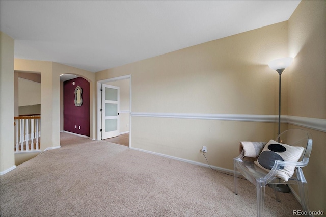 unfurnished room featuring light colored carpet