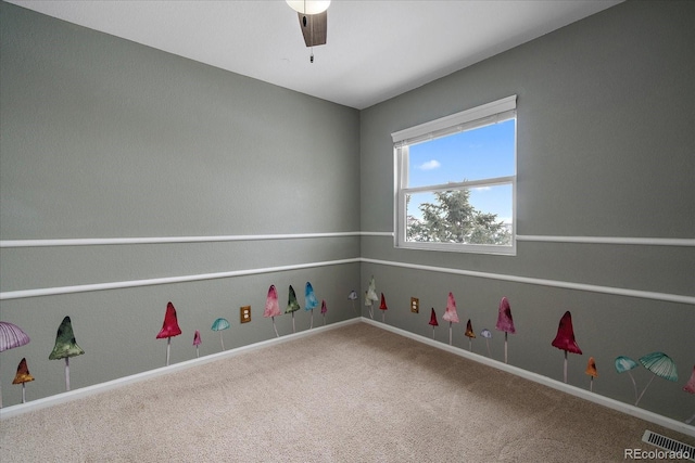 carpeted empty room with ceiling fan