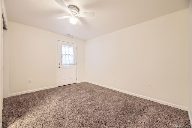 unfurnished room with carpet flooring and ceiling fan