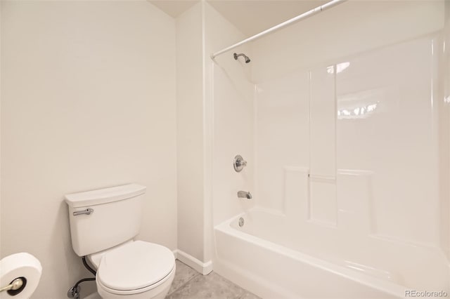 bathroom featuring tile patterned floors, toilet, and shower / tub combination