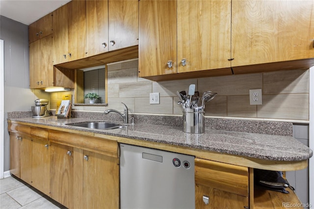 2143 S Downing St, Denver, CO 80210 - kitchen with dishwasher, decorative backsplash, stone countertops, light tile patterned floors, and brown cabinetry