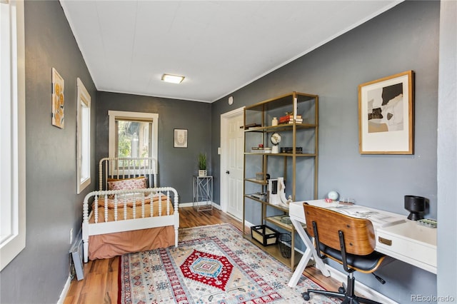 2143 S Downing St, Denver, CO 80210 - bedroom featuring an office area and wood finished floors