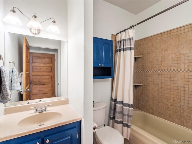 full bathroom with vanity, toilet, and shower / bath combo with shower curtain