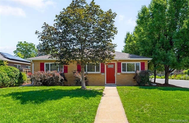 2900 Krameria St, Denver, CO 80207 - bungalow-style home featuring brick siding and a front lawn