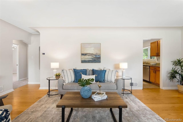 2900 Krameria St, Denver, CO 80207 - living room with light wood-style floors and baseboards