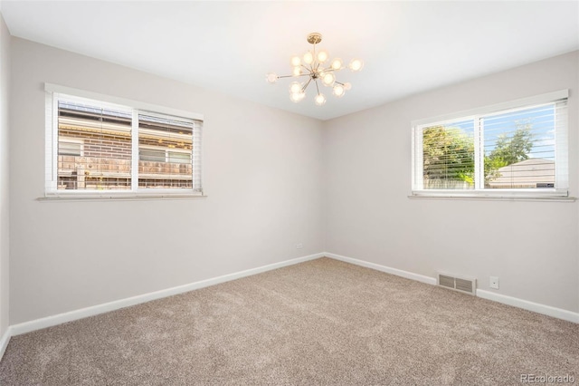 2900 Krameria St, Denver, CO 80207 - carpeted empty room featuring a chandelier and baseboards