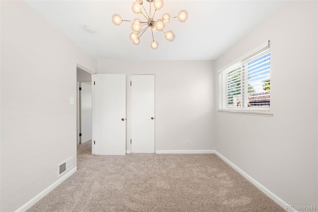 2900 Krameria St, Denver, CO 80207 - unfurnished bedroom featuring carpet and a chandelier